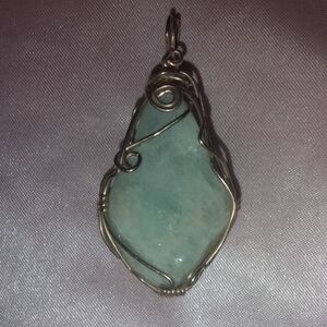 Elegant Wire Wrapped Aqua Marine Pendant.